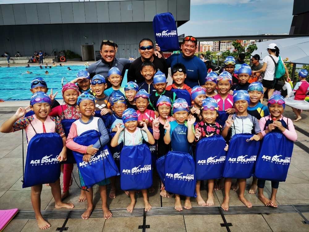 Students of Ace Dolphin Swim School gathered for a group photo