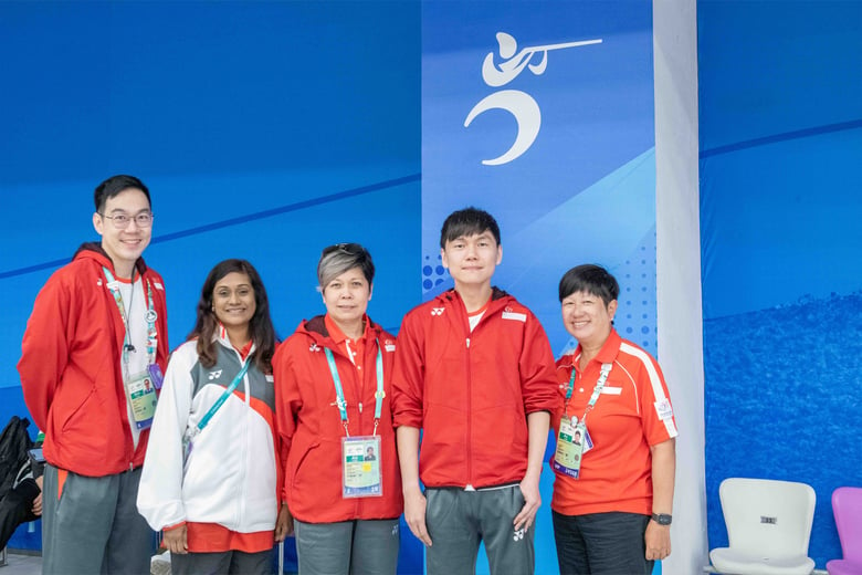 Paralympian Daniel Chan celebrates 5th place at the 4th Asian Para Games in Hangzhou with his team.