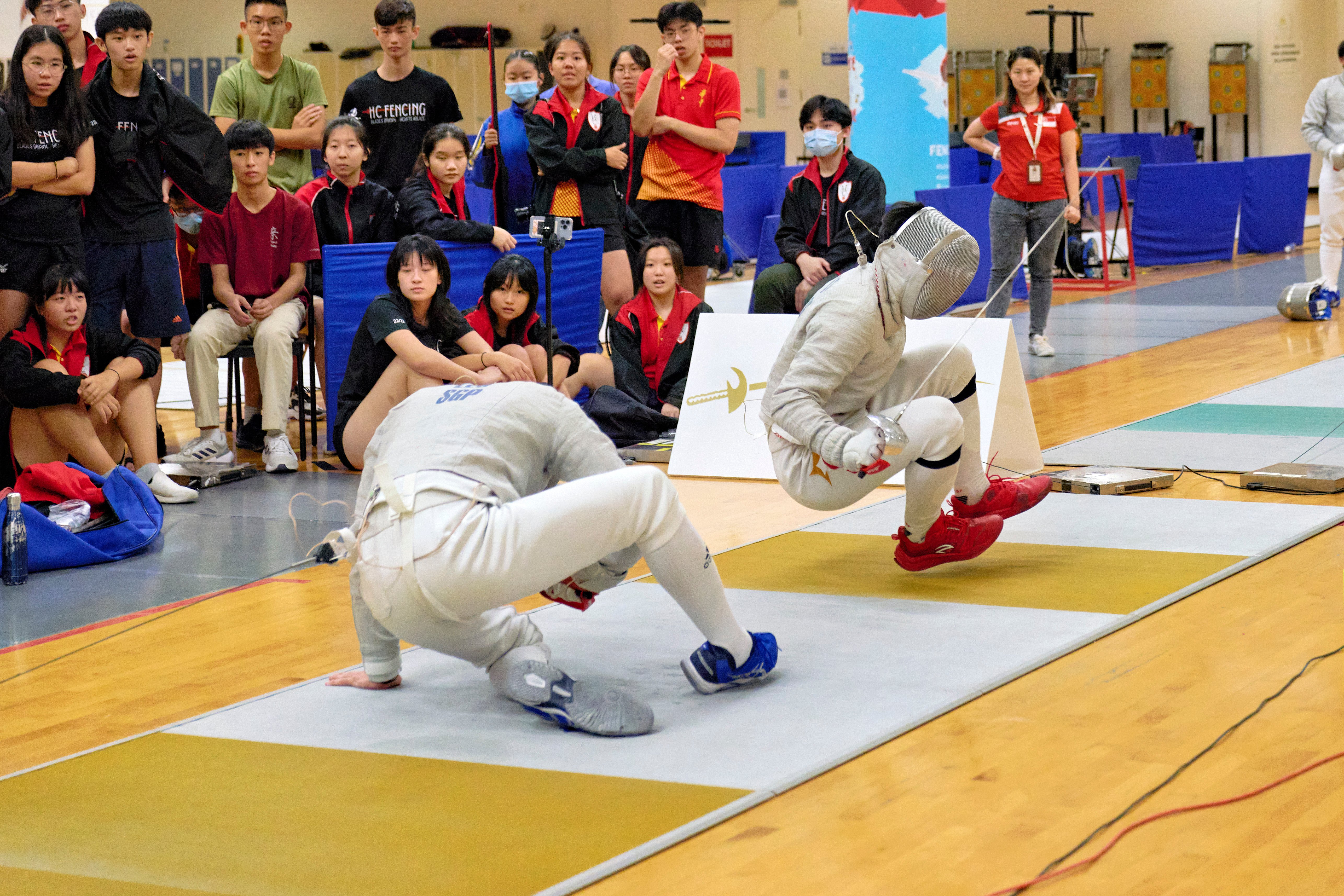 2023_04_20 Fencing Sabre A Div Boys Photo by Eric Koh, Fencers tumble at the end of the piste DSC9004