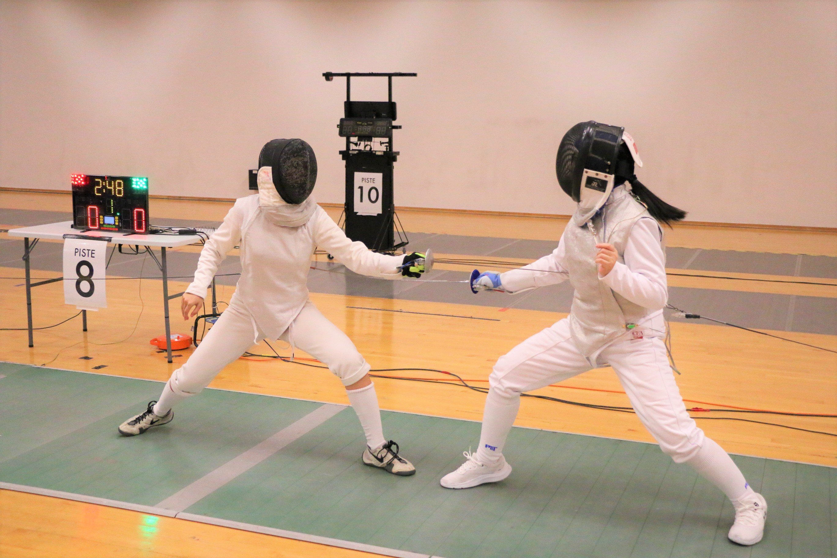 2023-04-20_NSG Fencing Womens Foil Div A_Photo by Anbumani(4)_LAI MISHKA SYIN YU vs SONG RUI QI GENEVIEVE (Elimination)