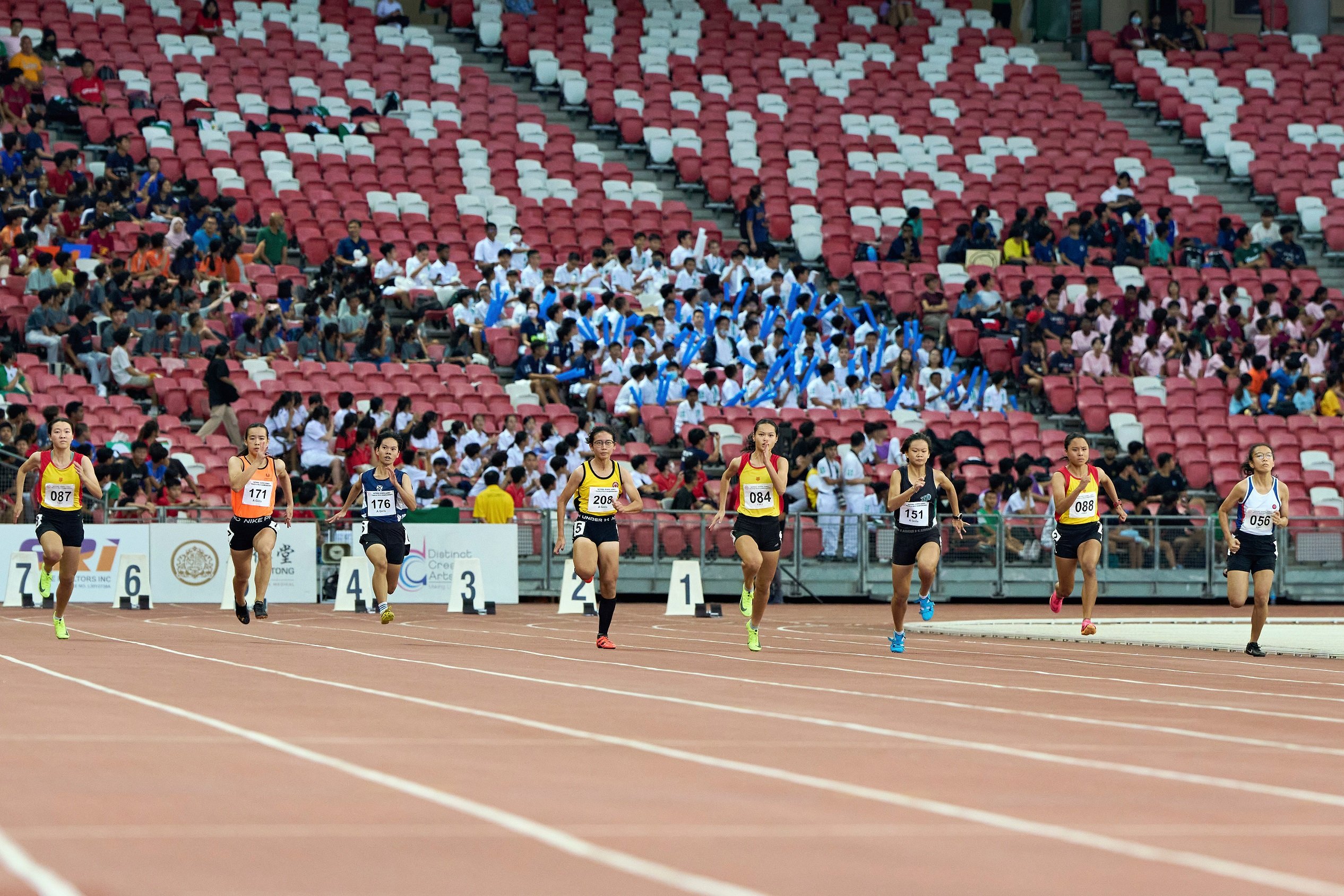 2023-04-28 NSG T&F Championships Photo by Eric Koh, A Div Girls race off from the starting blocks of 100m final DSC05866 1