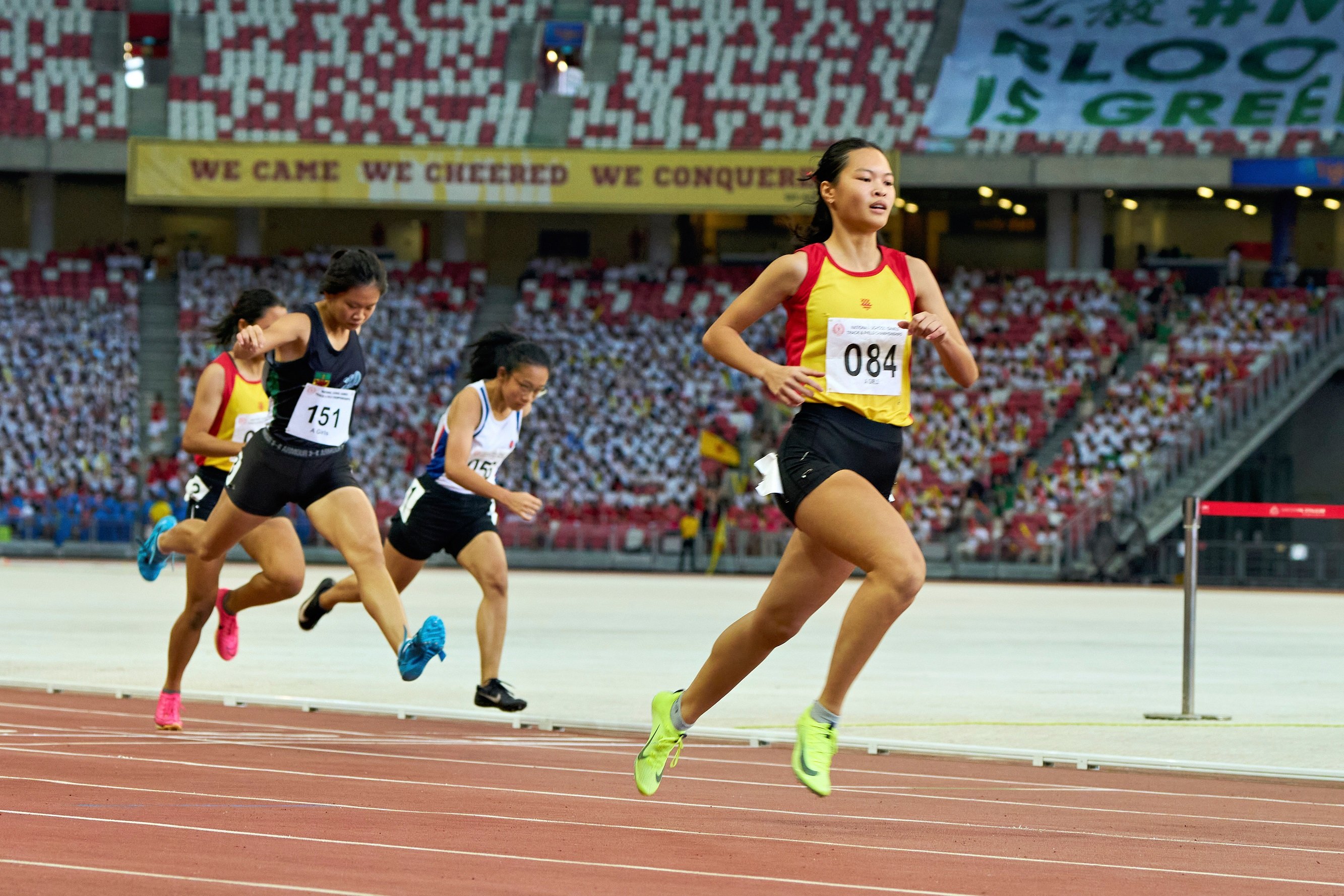 2023-04-28 NSG T&F Championships Photo by Eric Koh, Goh  En Ya Eleana(R) wins the Gold medal for A Div Girls 100m Final DSC05901