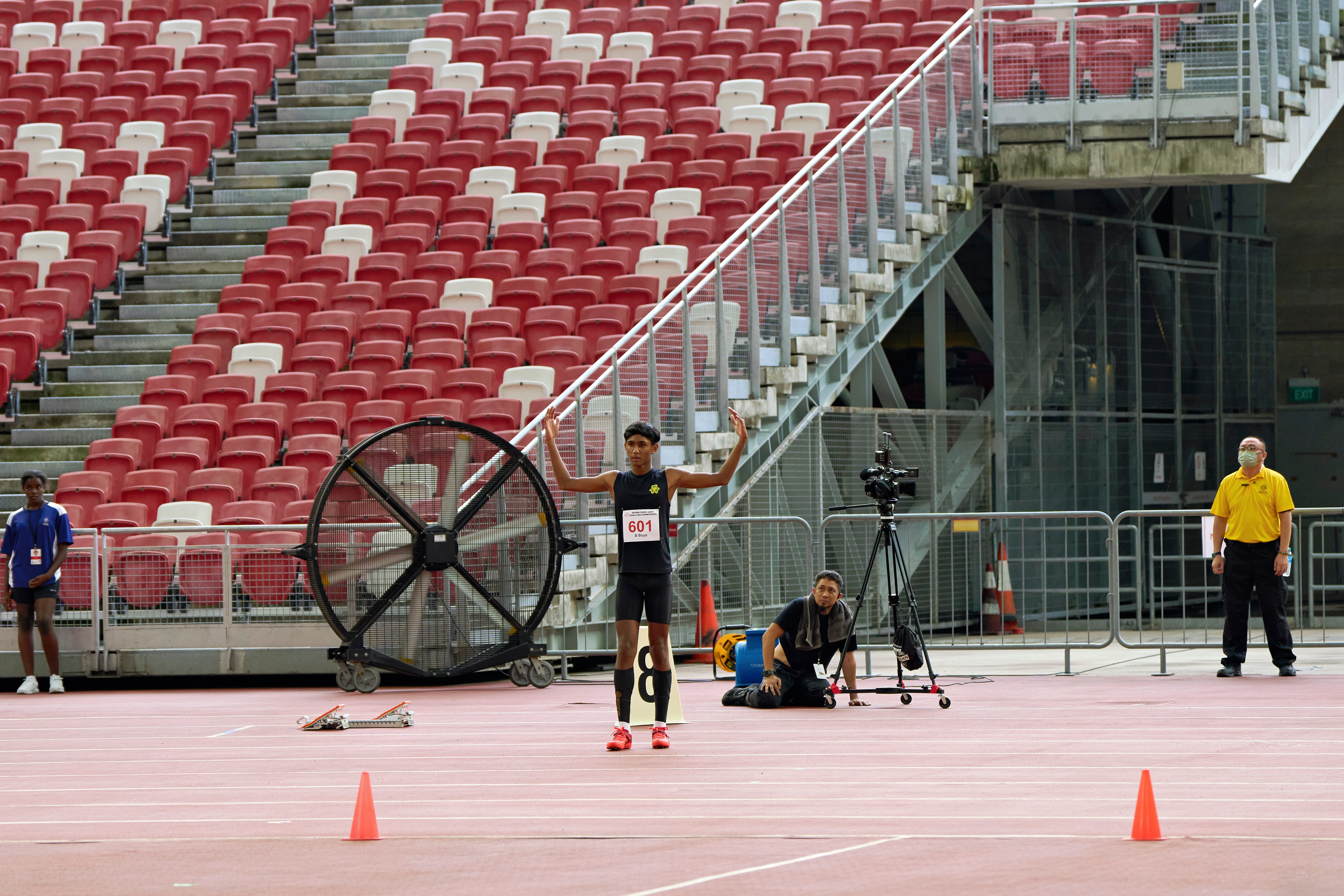 2023-04-28 NSG T&F Championships Photo by Eric Koh, S Viresh Kumar(SPS) seeks encouragement before his attempt DSC07376