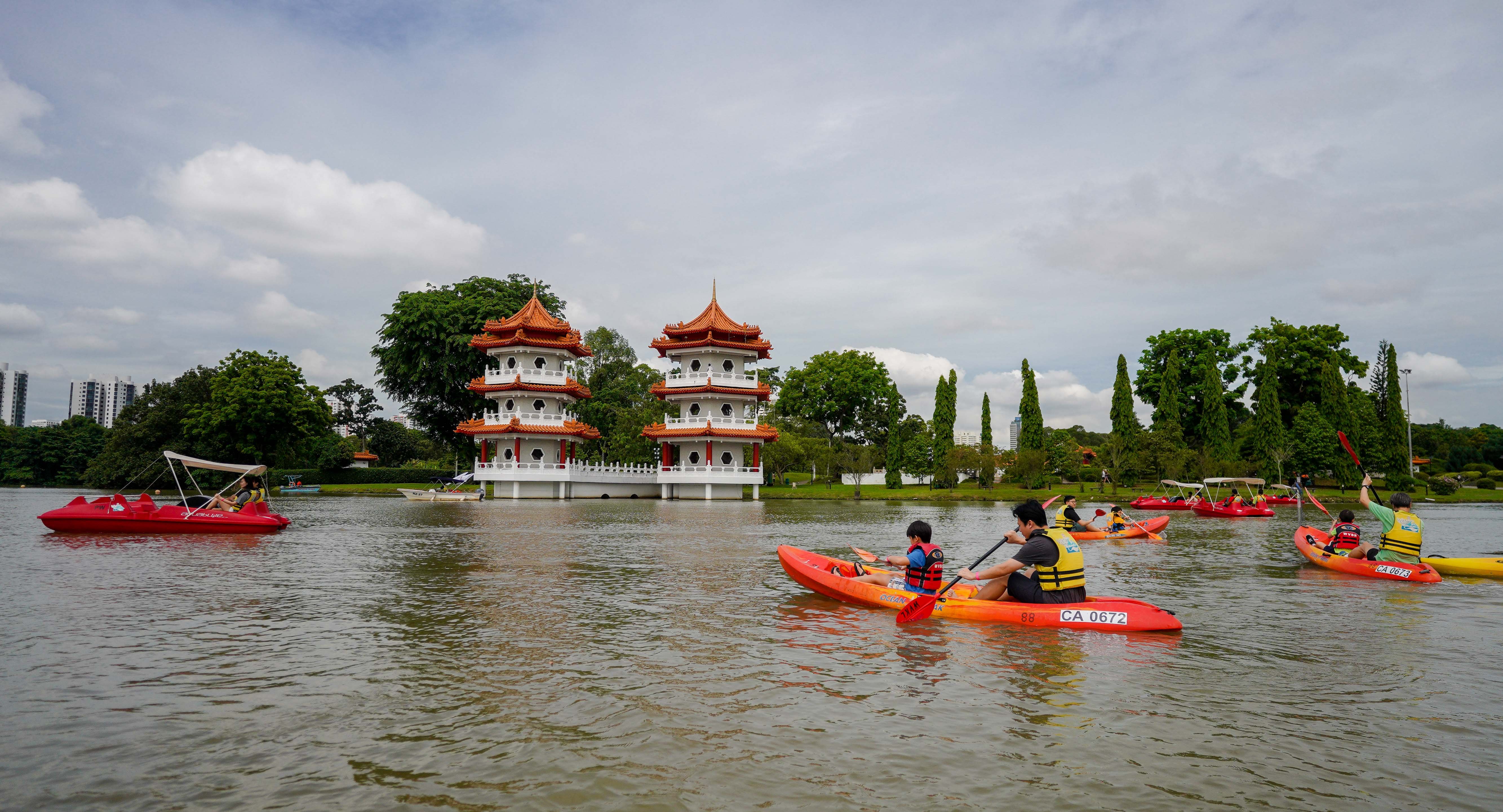 Parents kayaking with their kids as part of bonding time