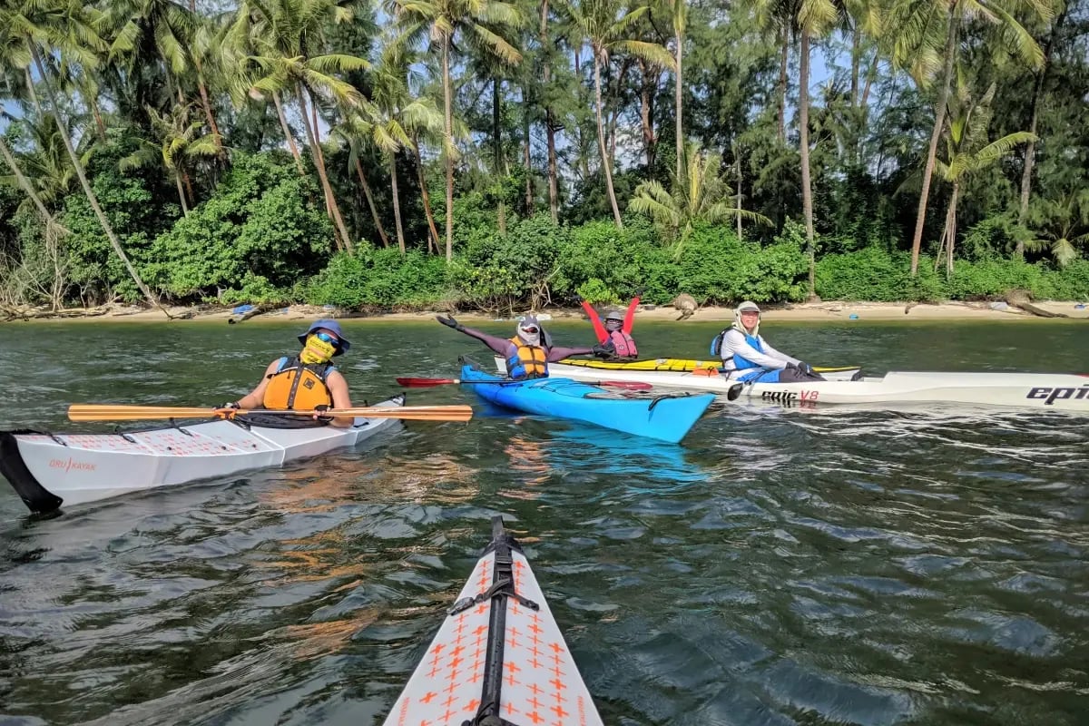 Experienced paddlers taking a break from kayaking for a photo