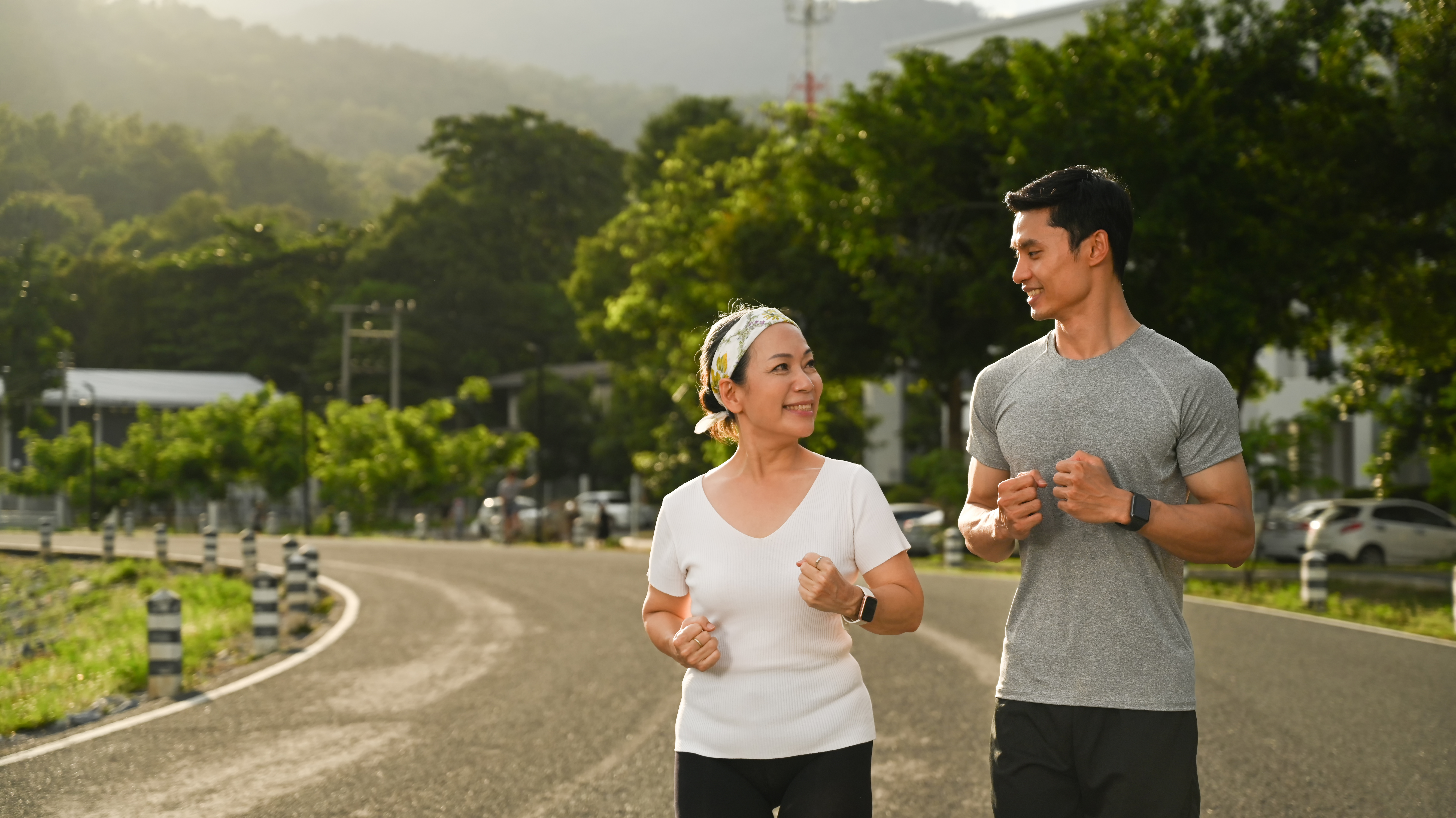 senior-woman-young-male-instructor-jogging-park-healthy-lifestyle-fitness-concept-1